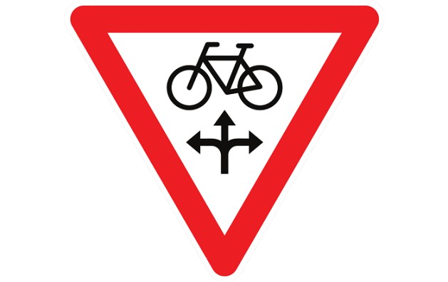 Panneau B22 : les cyclistes et speedpedelecs peuvent franchir un feu rouge ou orange dans la direction indiquée